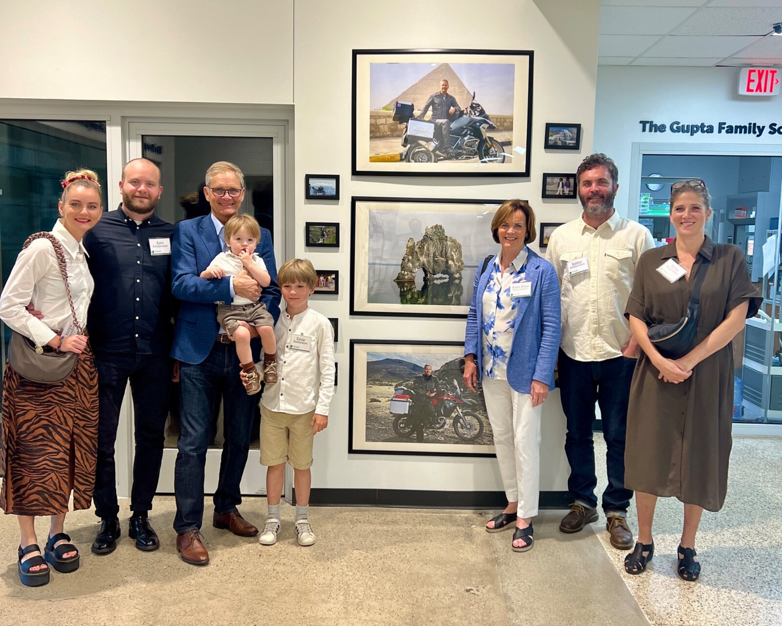 Kristján Gíslason and his family at Ottawa Hills High School with photographs from his journeys